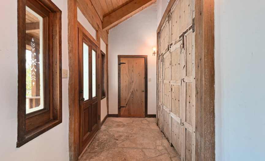 Front entry- Beautiful woodwork and stone floor.