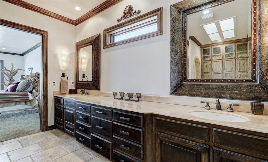Large double vanity bathroom, with soaking tub is off the primary bedroom.