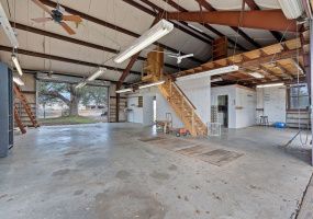 Zoned Commercial! Block from Town Square. A pass through garage! A pit, full bath and kitchenette  as well as a mezzanine level - amazing!