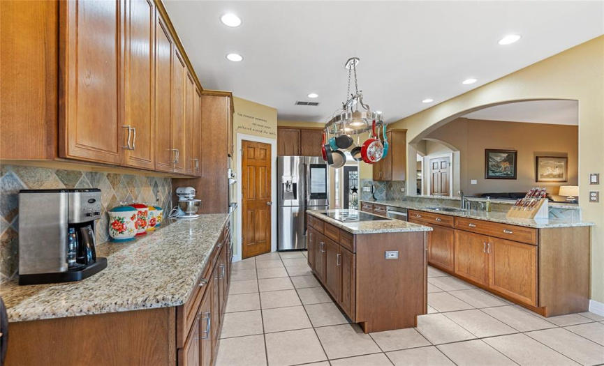 An Abundance of Custom Cabinetry and Granite Countertops * Additional Storage in the Center Island