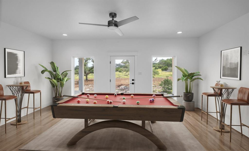Game room virtually staged: features bar no. 2 stocked with mini fridge and ice machine, leathered granite counter tops, half bath, access to balcony