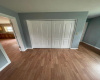 NEW LAMINATE FLOORING HAS BEEN COMPLETED AND NEW CLOSET DOORS AND FLOOR MOLDING NOW IN PLACE