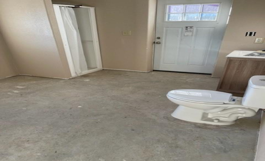 Large bath/utility/mudroom room off the kitchen. washer and dryer connections in place and ample room to make a Pantry area. Convenient shower to use after working in the yard or pasture.