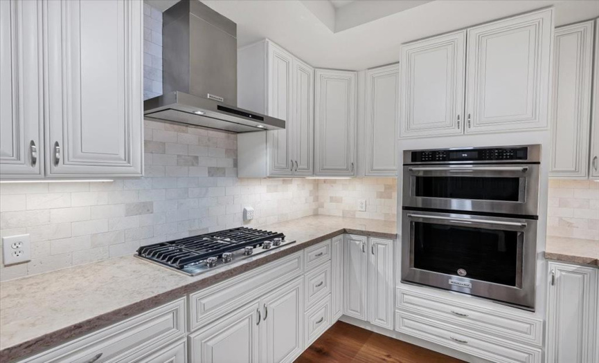 The kitchen has clean and sleeks lines while hidden behind the cabinets are upgraded pullouts and more surprises.