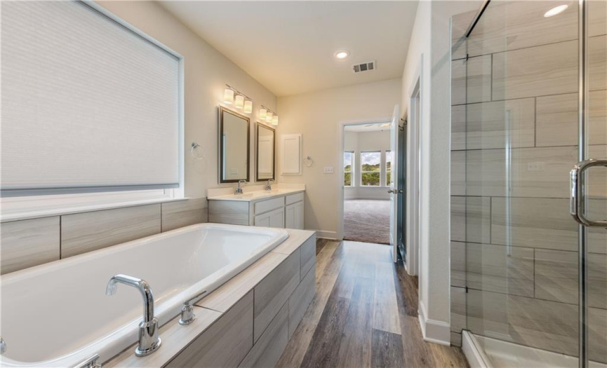 Soaking tub with large picture window and plenty of natural light. 