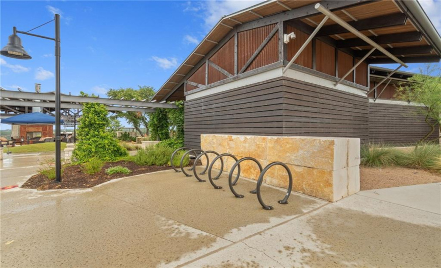 Amenity center has walking paths and bike racks.  Ride your bike to the gym, or bike down one of the many biking and hiking trails in the neighborhood! LOTS AND LOTS OF GREEN SPACE and TRAILS TO EXPLORE!!!