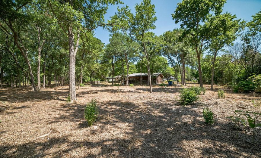 Selectively cleared lot within Austin with utilities and back unit. Paved public road with curbs in front. Stellar zip code for development 78723. _1 ACRE FOR SALE: 2923 Pecan Springs Rd., Austin, Tx 78723