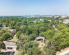 Ariel photos shows property garage in the clearing just to the right. Stellar location. 78723 is near Mueller and all that it has to offer. Talk to the city about tear down and multiple units or restore existing structures. RARE OPPORTUNITY for a lot this size. _1 ACRE FOR SALE: 2923 Pecan Springs Rd., Austin, Tx 78723