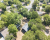 Ariel direct top view of main house under trees and exposed oversized garage/studio/workshop. Fantastic land! _1 ACRE FOR SALE: 2923 Pecan Springs Rd., Austin, Tx 78723