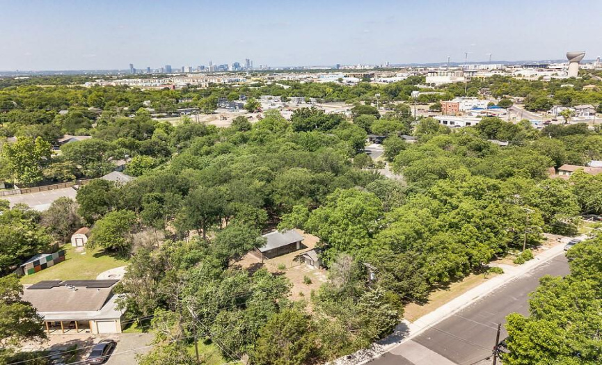 Ariel photo shows property just to the right with downtown in the background. Well established and maintained area. You can also see Mueller in the background. Massive lot in zip code 78723. _1 ACRE FOR SALE: 2923 Pecan Springs Rd., Austin, Tx 78723