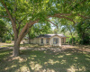 Front view. Has had a tenant until past few years. ALL UTILITIES ARE CONNECTED. FIXER UPPER. _1 ACRE FOR SALE: 2923 Pecan Springs Rd., Austin, Tx 78723