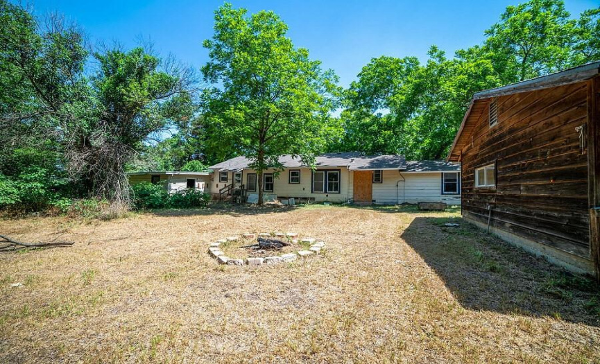Well kept lot. Structures have great bones! Professionally gutted to studs. Easy remodel or tear down. LOTS OF POTENTIAL EITHER WAY. _1 ACRE FOR SALE: 2923 Pecan Springs Rd., Austin, Tx 78723