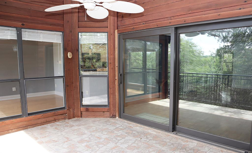 The windows that let light into the home also help visually expand the spacious deck, creating an inviting second living area on all but the most inclement of days.