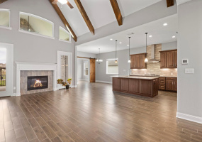 High ceilings, beautiful flooring, inviting family and friends to spacious kitchen and family room.