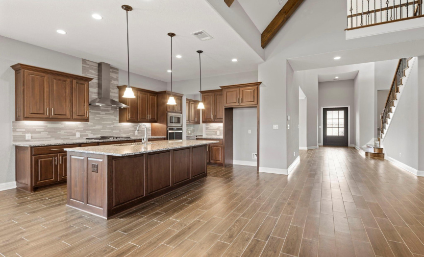 Open floorplan featuring beautiful tile floors all through the downstairs.