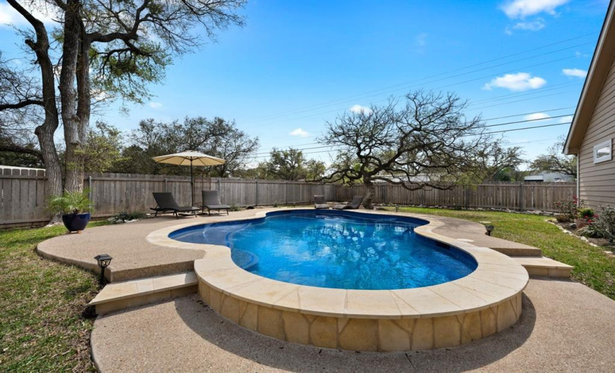 Outdoor living in this private, back yard w/ pergola, stained deck and stained concrete patio. Not to mention the beautiful cozy outdoor fireplace to gather around on cool evenings.  