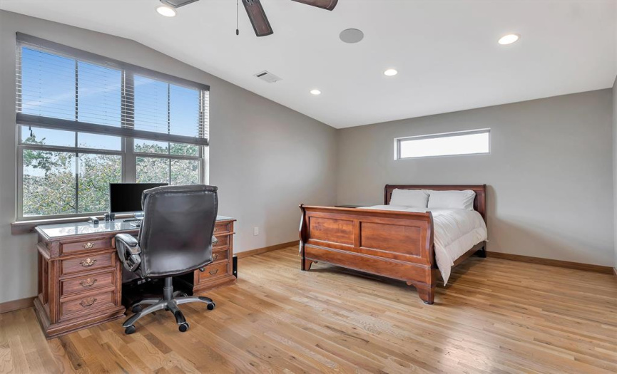 Oversized bedroom is spacious enough for a king sized bed and either an desk or sitting area or both and has a ceiling fan and blinds. The unit has hardwood flooring throughout the main living spaces.