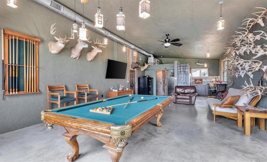 On the main floor of the additional dwelling unit is this bonus space that's perfect for a game room, or man cave. Again, the choice is yours.