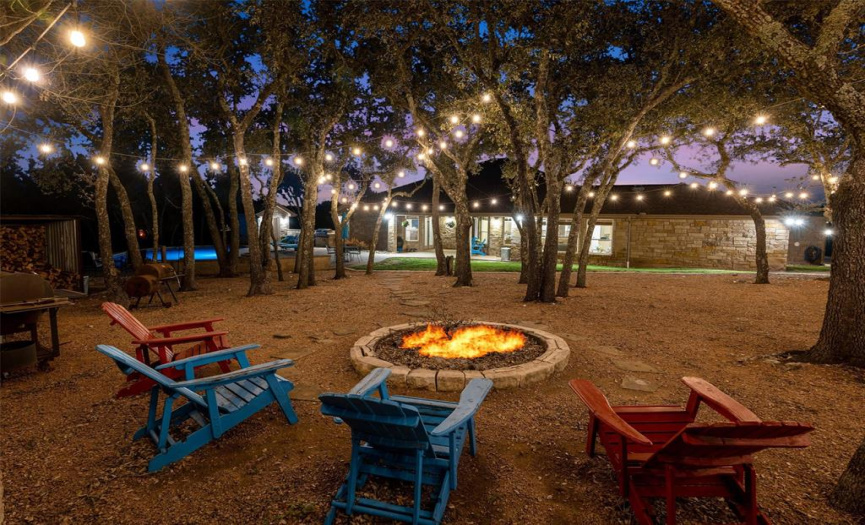 Relaxing around the fire pit or cooking s'mores - it's just one more place to enjoy yourself. To the right, is room to play bocce ball, horseshoes or washers. It's also a great place to take a nap in a hammock.