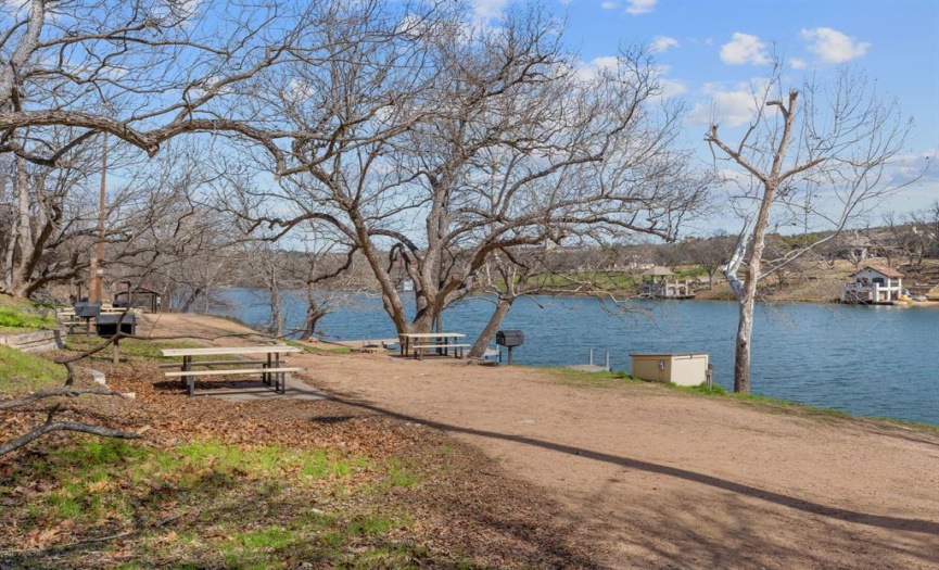 Waterfront day use park with day docks and picnic benches along Lake Austin