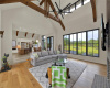 White oak wood flooring, large fan ,and exposed wood beams. Views from the front of the house. 