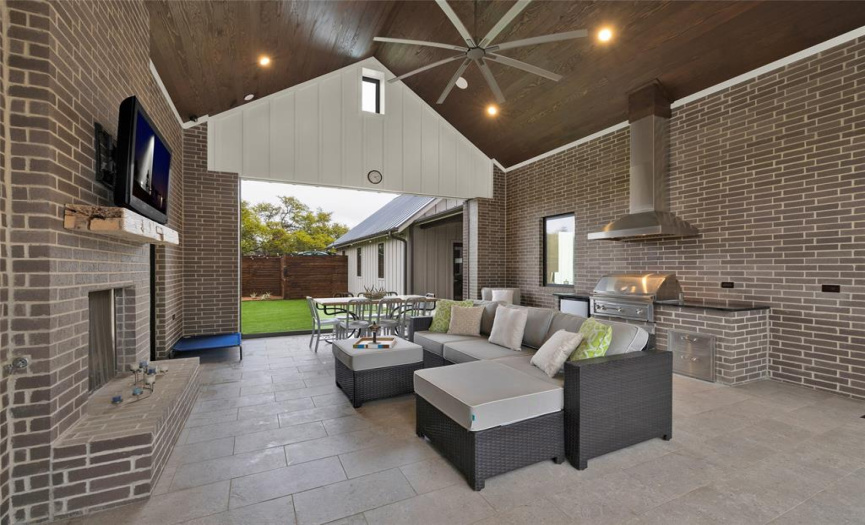 Outdoor Entertainment area built in kitchen, yard, and guest house.  