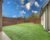 Outdoor yard with astro turf. 