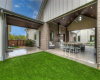 View from astro turf yard into entertaining area and walkthrough from the garage.