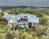 Aerial view of the back of the home which allows you to view the entire home.