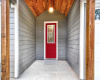 Covered front porch w/ accent ceiling - door color virtually staged