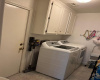 Laundry area and mud room for rear entrance.