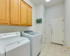 The utility room features a skylight for natural light and the washer/dryer convey!