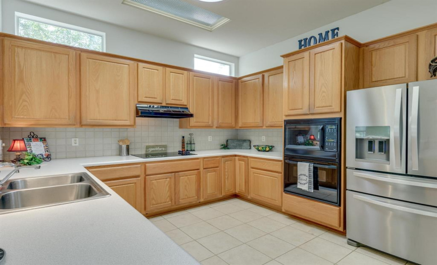Great kitchen layout with upgraded stainless steel refrigerator.