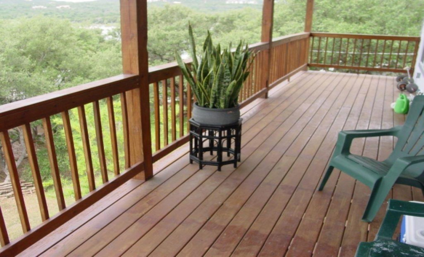 Upper level covered deck with scenic lake & hill views