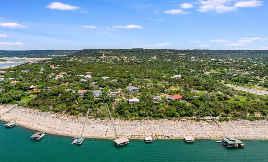 Our Lake Travis deep water shoreline behind this waterfront home at low 638 ft lake level