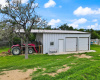 Metal Equipment Barn w/ Separate Storage Room. Separate Hay Store Behind Stable