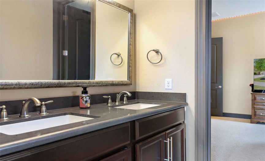 Bath between bedrooms 2 and 3. Has double vanities and separate tub/shower and toilet room.