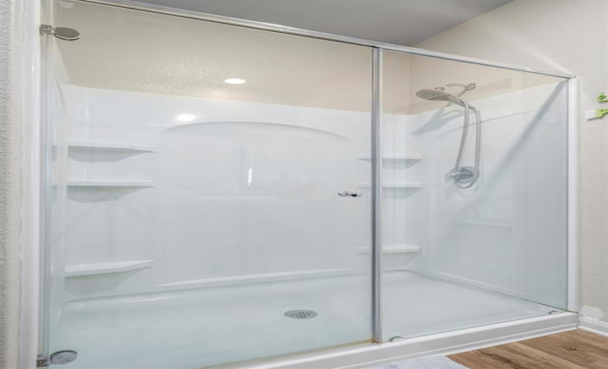 Nice walk-in shower with detatchable shower head and plenty of space.