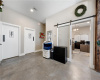 Off of the reception/foyer is the fifth private office with sliding glass barn door