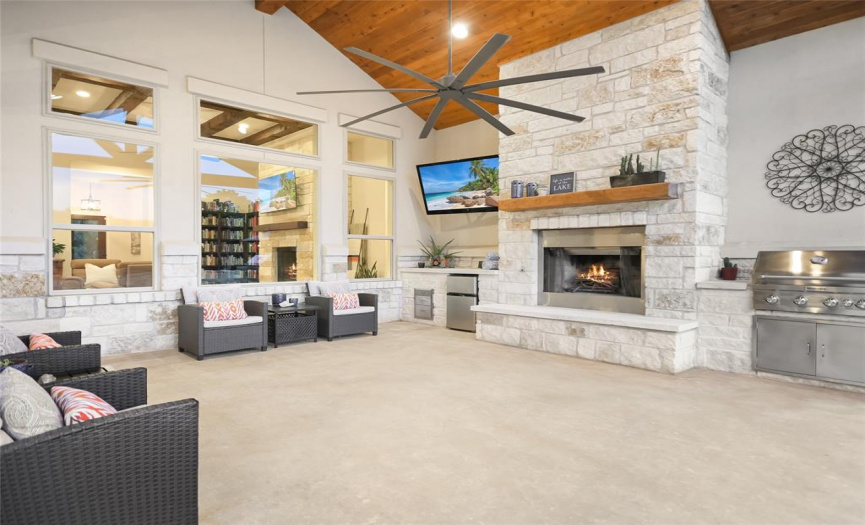 Outdoor Area includes Oversized Fan, TV, Fireplace, Refrigerator, and Grill
