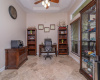 Office/Study with Tray ceiling, French Doors, Travertine flooring