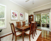 Wonderful thin plank hardwood floors, plantation shutters and crown molding appoint your formal dining space.