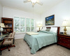 Main bedroom is comfortably carpeted with private-feel back yard and greenbelt views.