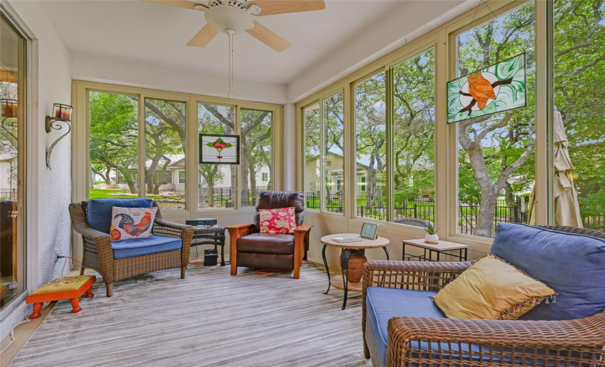 Peaceful outdoor living space from within the comforts of an extended sunroom.