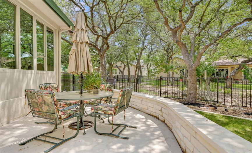 Dine al fresco on your extended flagstone patio with limestone seating wall.