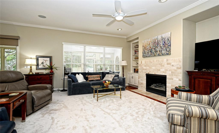A living room fireplace provides both warmth and ambiance in your hard wood floor living room.