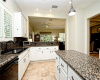 Enjoy a granite counter center island in your light, bright, open kitchen.