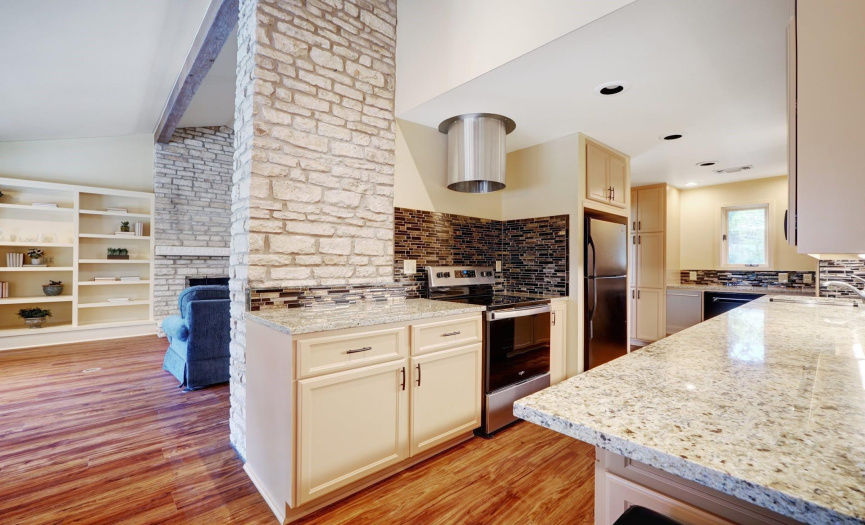 Texas stone accents the kitchen with granite countertops
