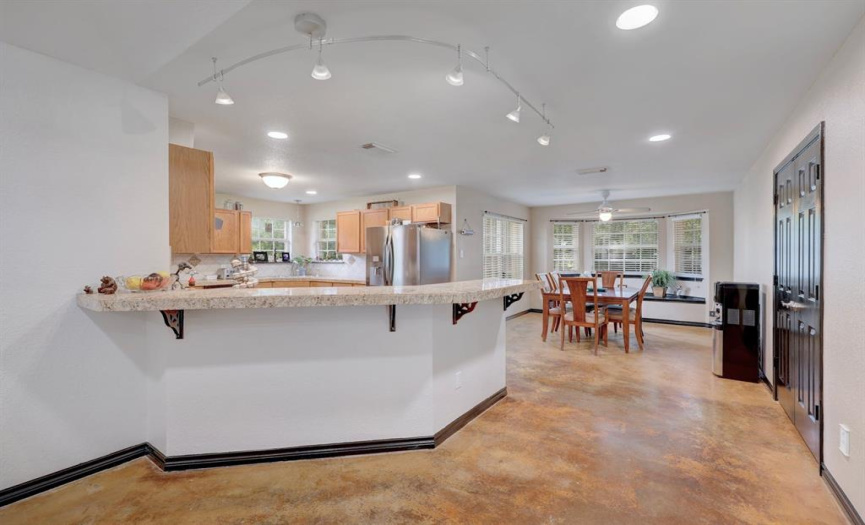 The heart of the home is the impressive kitchen which offers views into the living room and is flanked by a formal dining room and breakfast room.