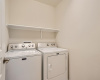 Washer and dryer located close to master bedroom and kitchen for convenience.  Washer/Dryer convey with the sale of the home. 